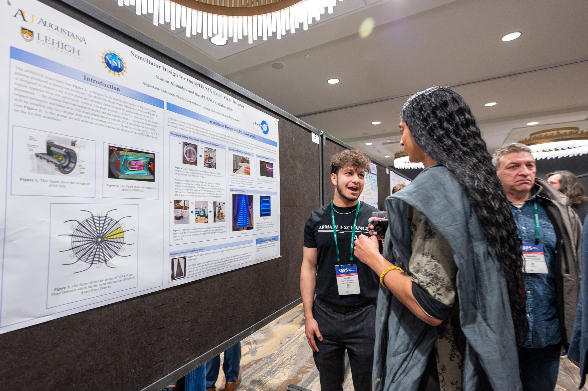 A student presenting a poster