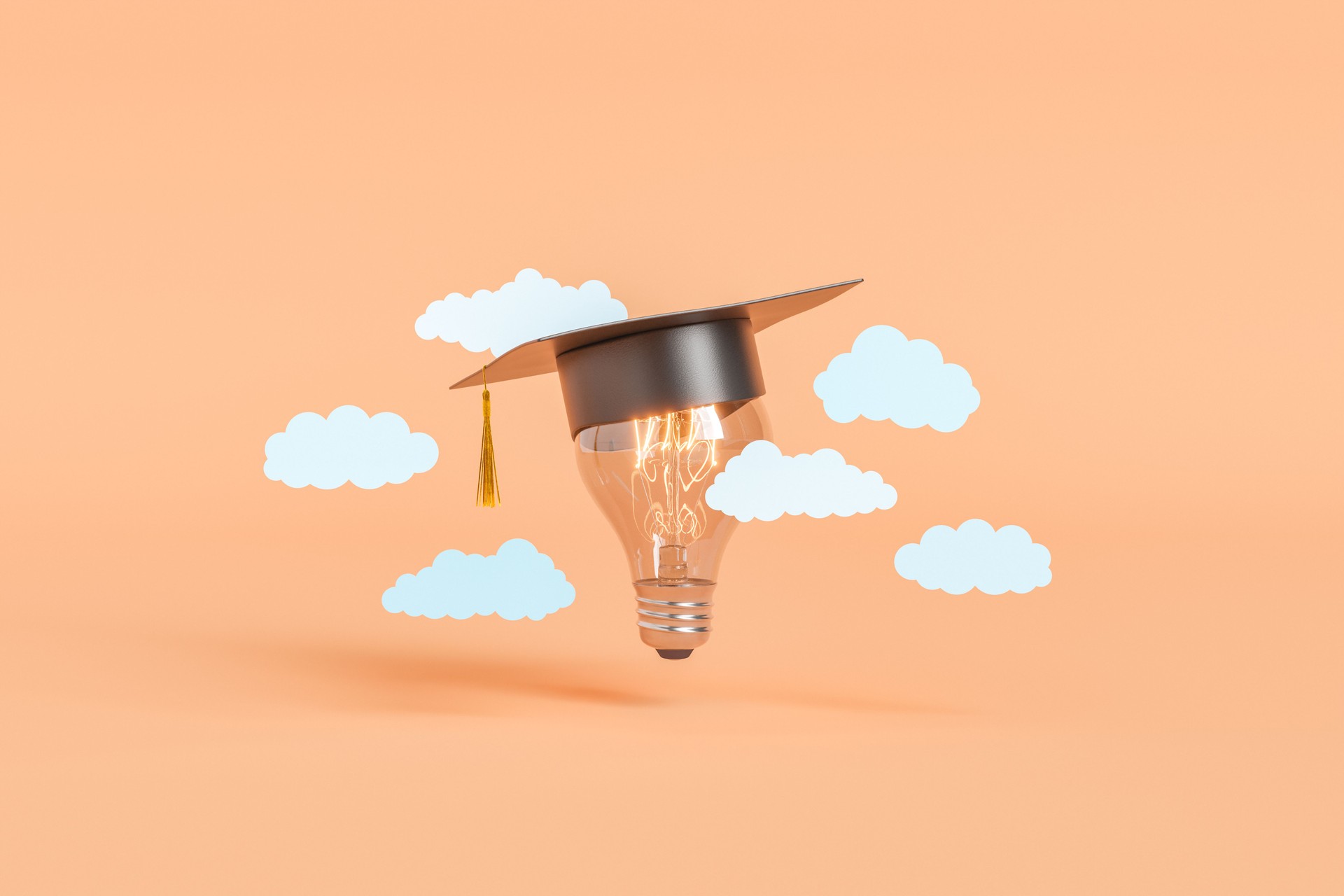 Image of lightbulb with graduation cap with clouds