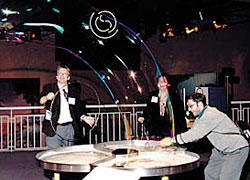 gala03.jpg - 25976 Bytes Blowing giant soap bubbles at the Fernbank Museum's interactive science exhibit, open to all those attending the APS gala celebration.