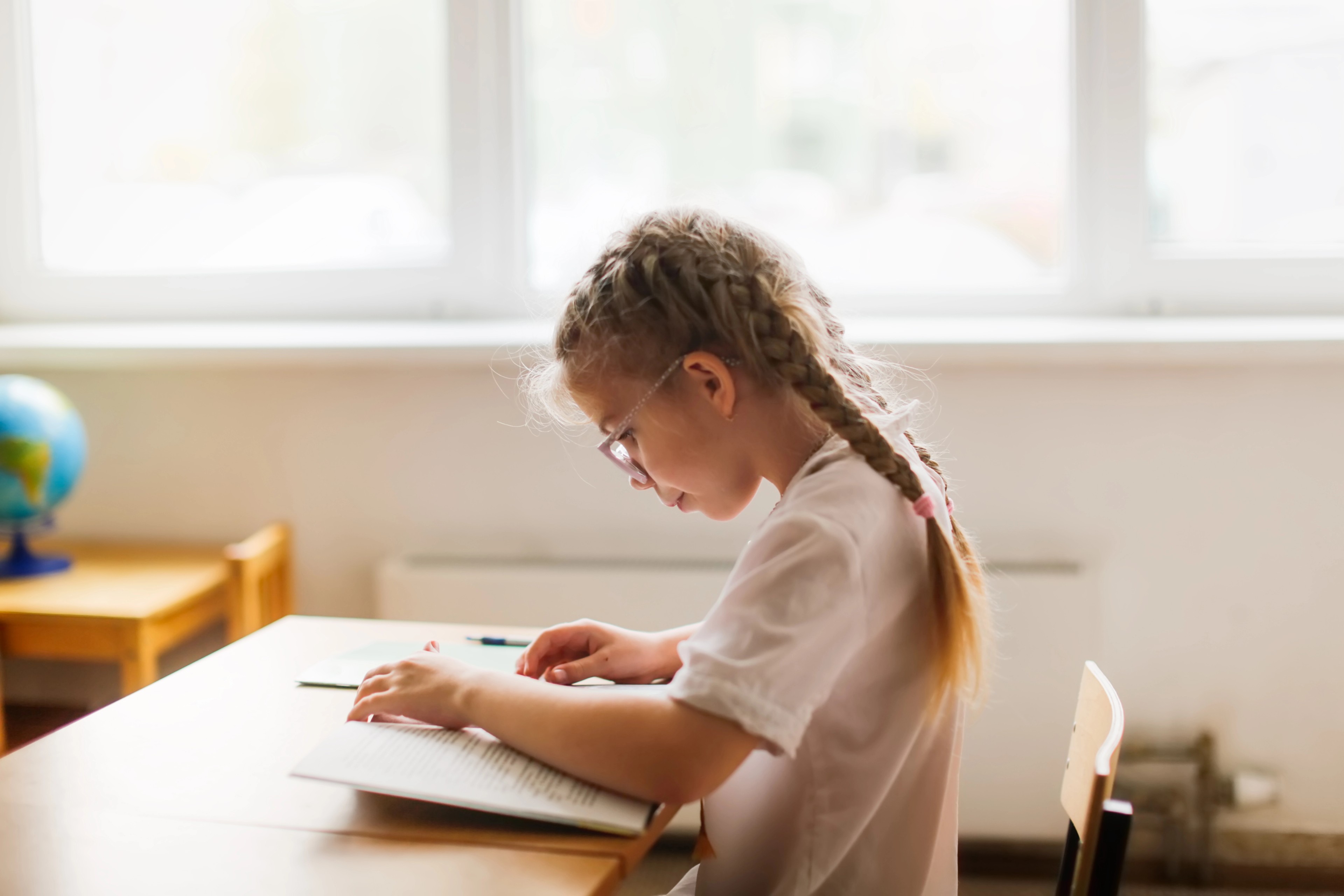 Little girl at desk