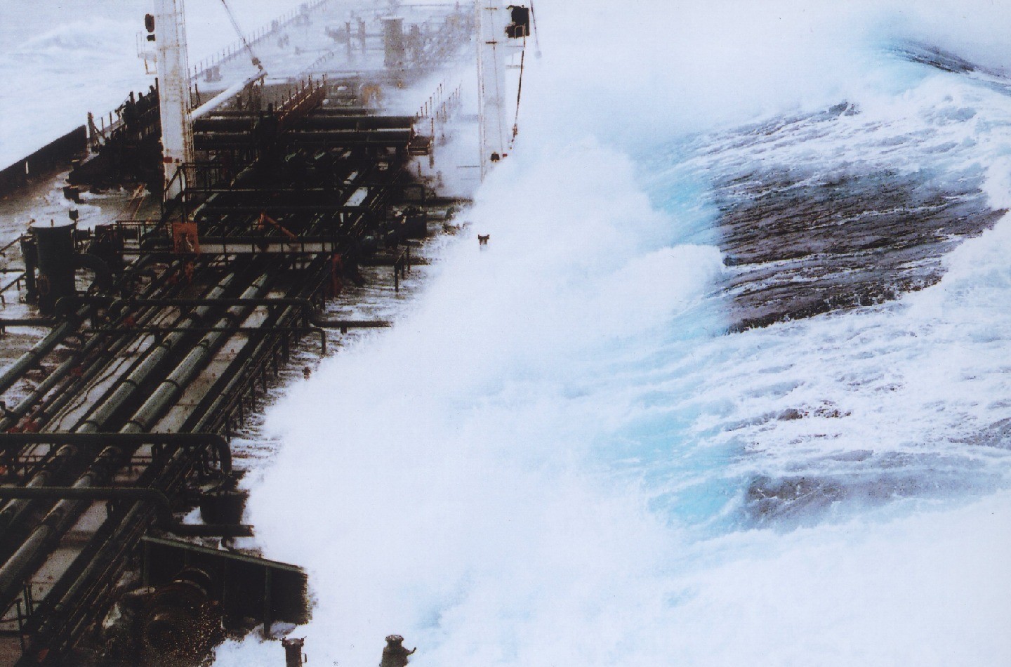 A rogue wave more than 60 feet tall strikes a tanker