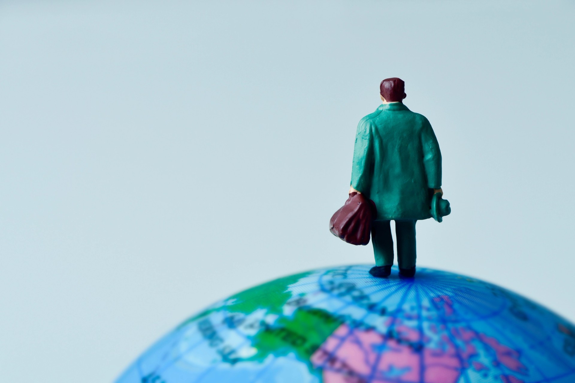 man standing on globe