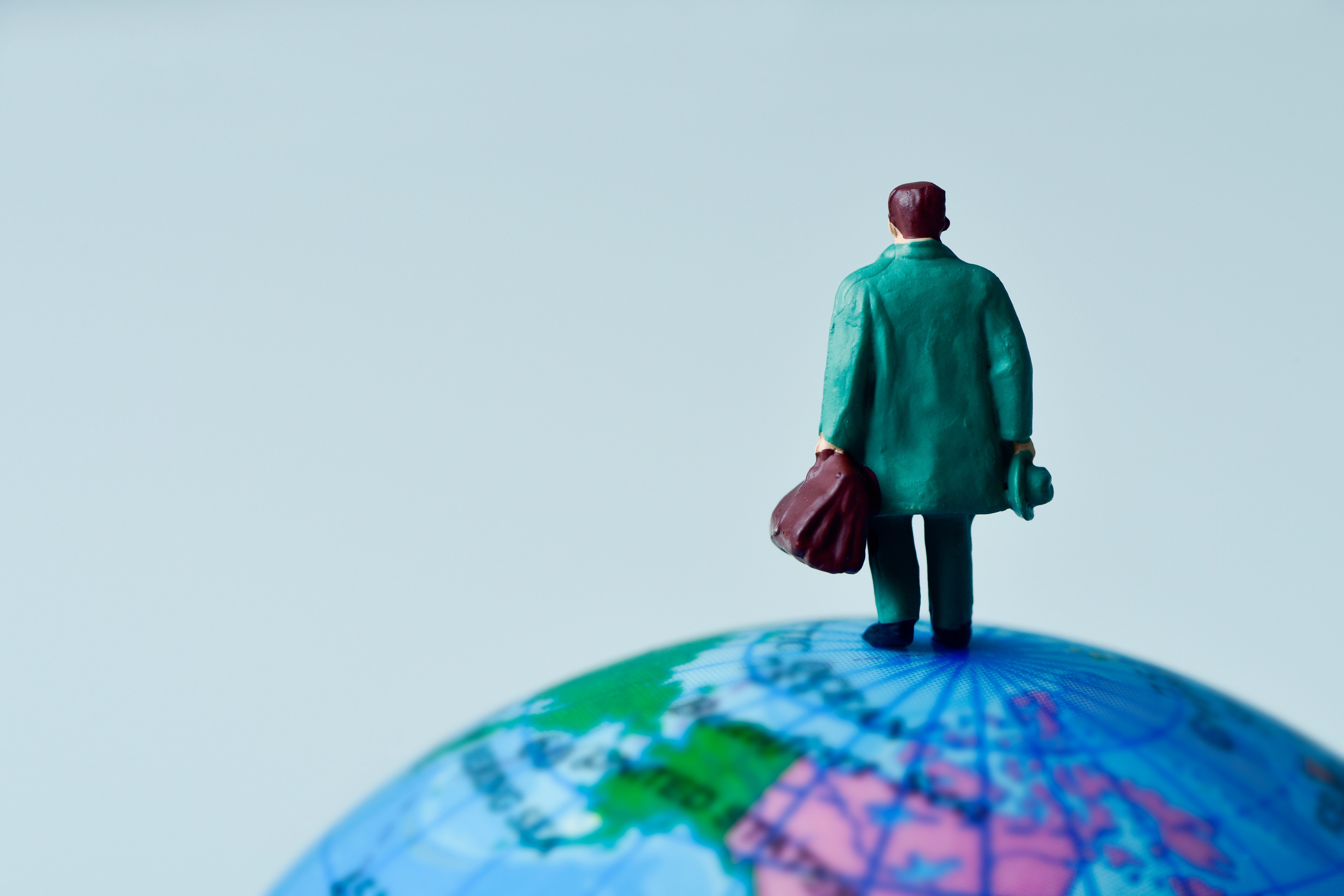 man standing on globe