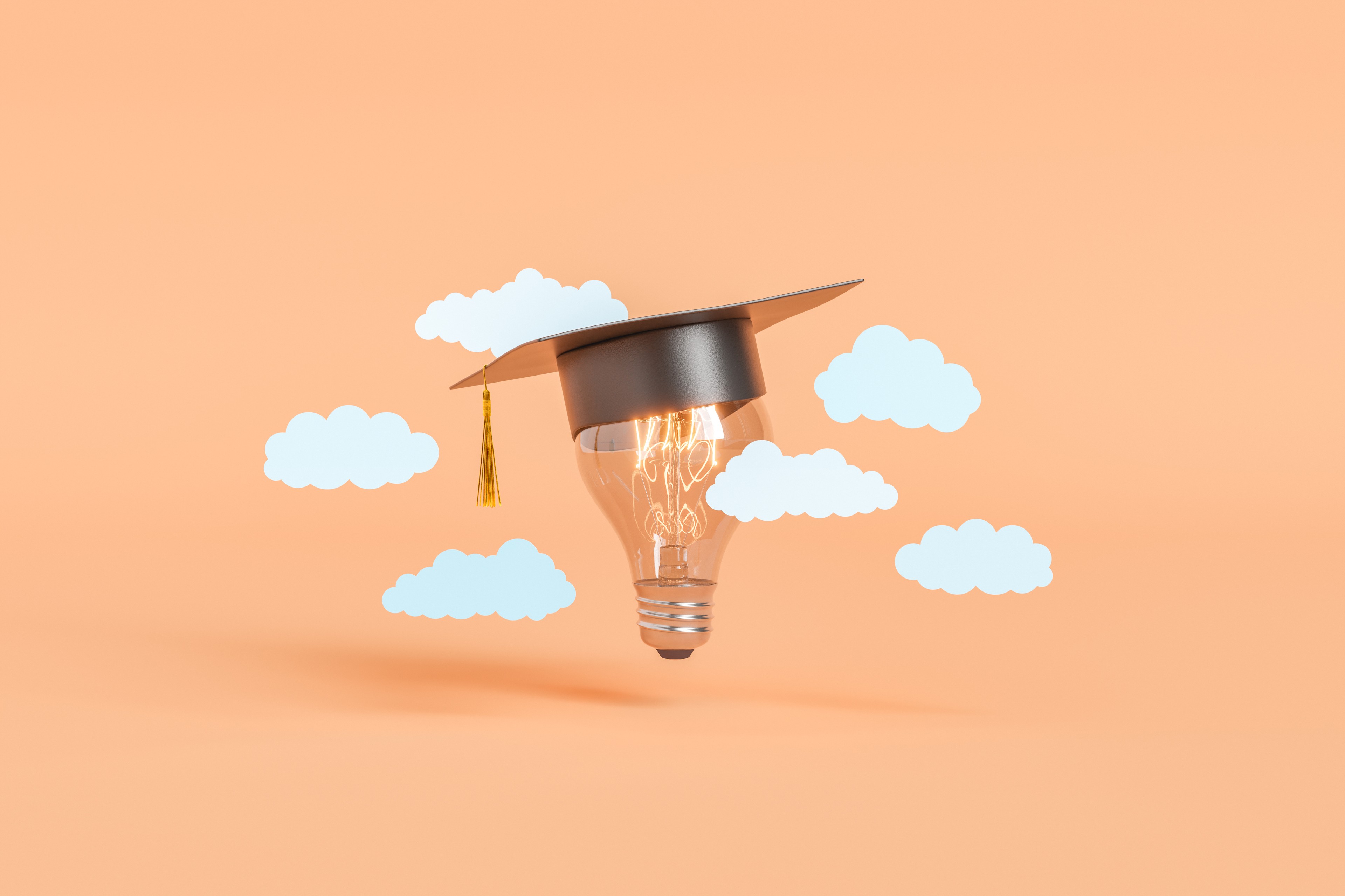 Image of lightbulb with graduation cap with clouds