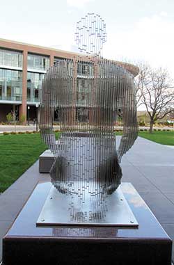 Artist Julian Voss-Andreae uses parallel metal plates to represent human forms in his sculpture