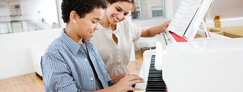child taking piano lessons slide
